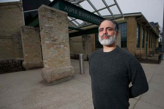 JOHN WOODS / WINNIPEG FREE PRESSRabbi Kliel Rose of Congregation Etz Chayim stands in front of the Asper Jewish Community Campus Sunday. Rose says safety is important but he doesn’t want people paralyzed by fear.