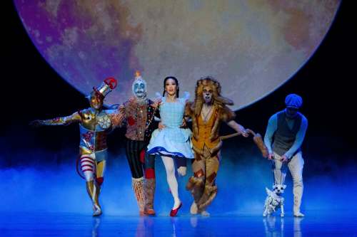 The Tin Man (Yosuke Mino), Scarecrow (Stephan Azulay) , Dorothy (Sophia Lee) and the Lion (Liam Caines) with Toto (puppeteered by Cameron Fraser-Monroe). (Daniel Crump / Royal Winnipeg Ballet)
