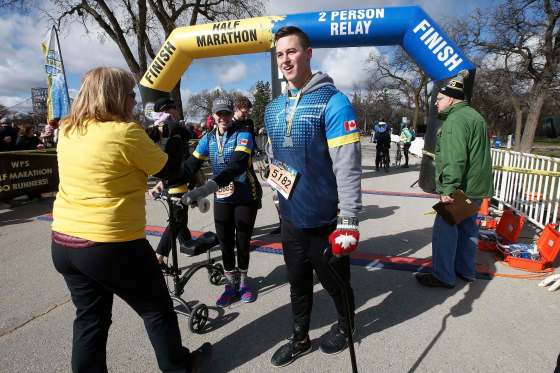JOHN WOODS / WINNIPEG FREE PRESSShane Dyck completes the half marathon with his girlfriend, Natalie Caister, for his mom Irene who died of cancer May 26, 2018, and was there for him in every step of his recovery. The run occurred at Assiniboine Park in Winnipeg Sunday.