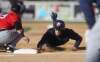 TREVOR HAGAN / WINNIPEG FREE PRESS
Goldeyes base runner Wes Darvill dives safely back to first base during American Association pre-season baseball play on Thursday in Winnipeg.