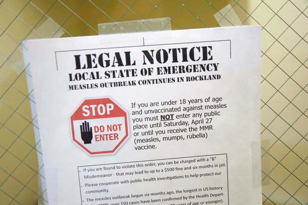 A sign outside the Rockland County Health Department in Pomona, N.Y., details a local state of emergency created by a measles outbreak. (Seth Wenig / The Associated Press files)