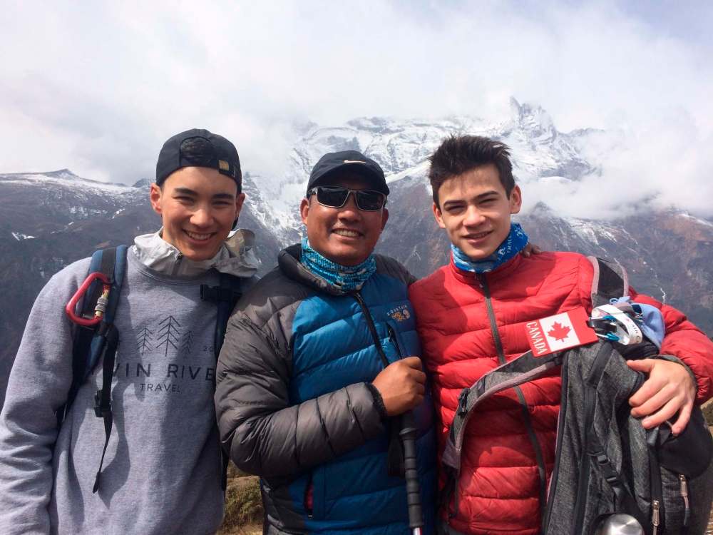 Photos by Taschi Klaschka / Winnipeg Free Press
Taschi Klaschka (from left), guide Nurbu Tamang and Scott Mann arrived in the town of Lobuche, with Mount Lobuche hidden in the clouds, after a long trek.