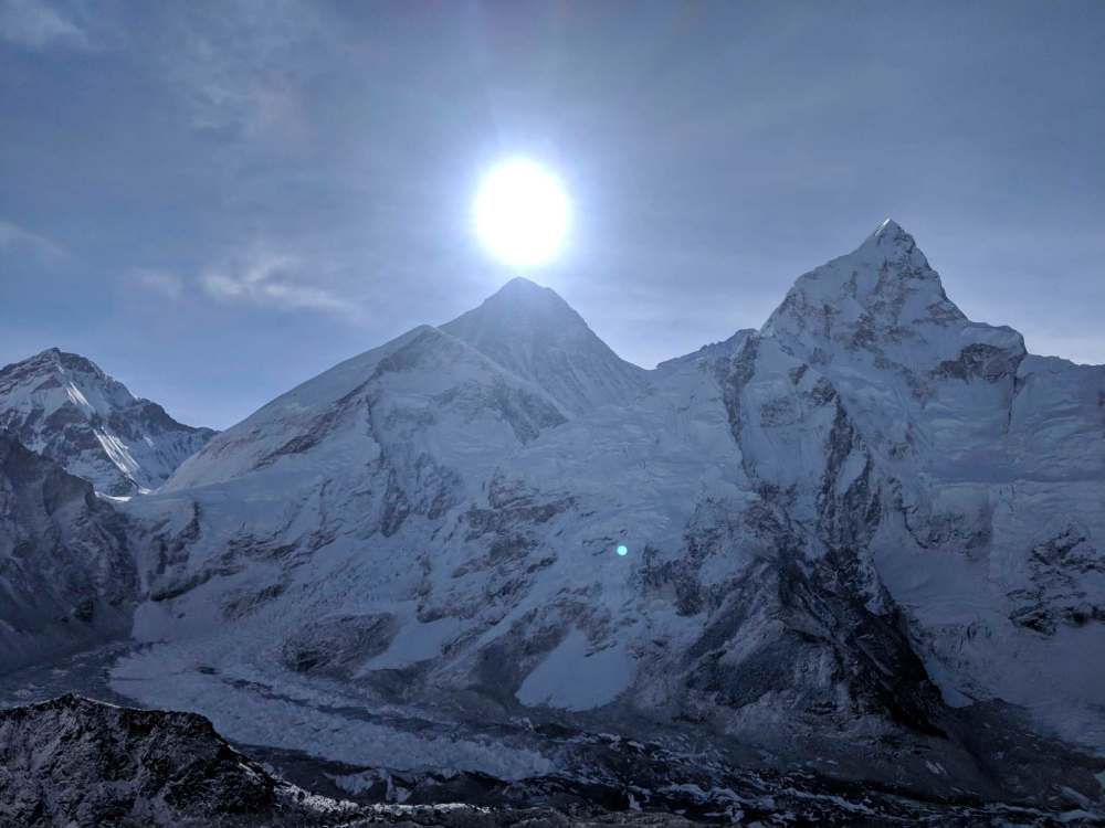 Looking across from the town of Kala Patthar as the sun rises over Everest.