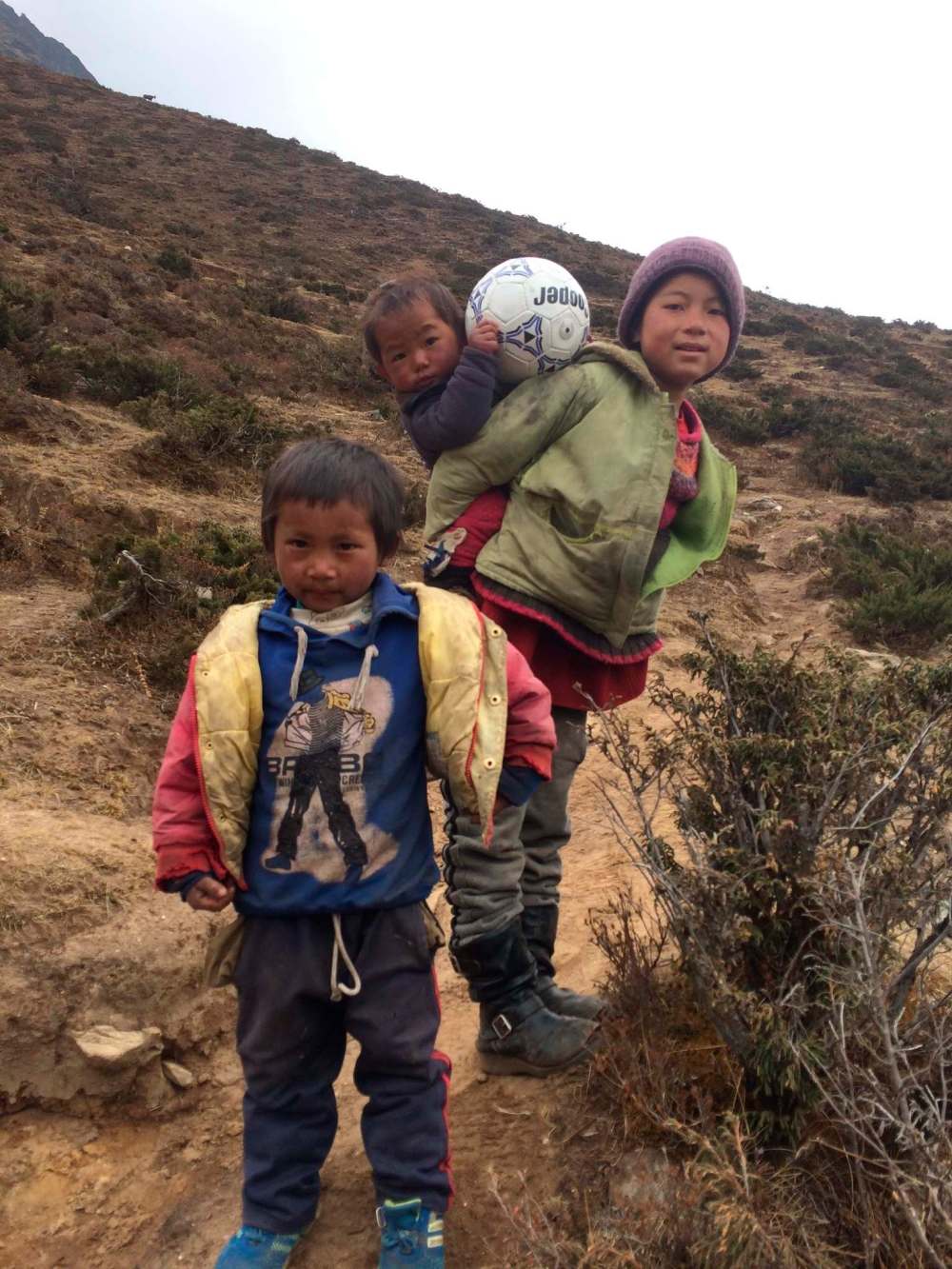 Passing through a Sherpa village on the last day of our trek down, we encountered some young kids, who we gave a soccer ball.