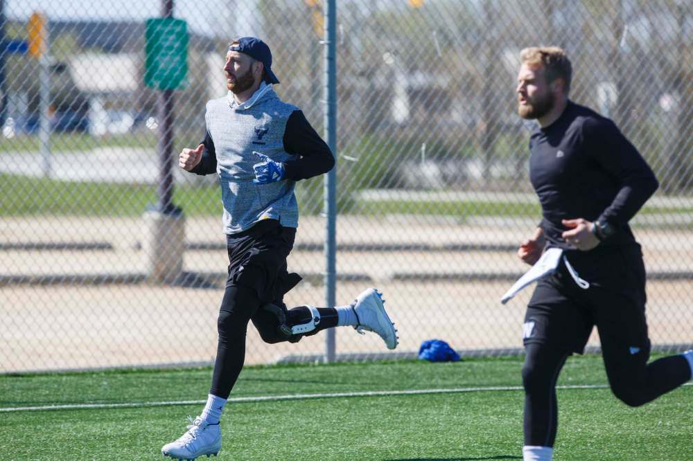Matt Nichols (left) and Chris Streveler didn't have to be at training camp Friday, but were there anyway. (Mike Deal / Winnipeg Free Press)