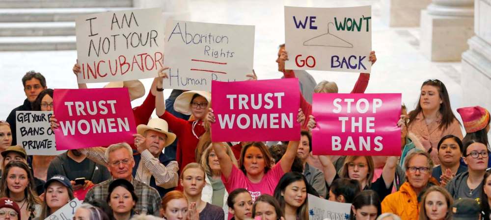 Rick Bowmer / The Associated Press
Activists gather in the Utah State Capitol rotunda on May 21 to protest abortion bans happening in Utah and around the U.S.