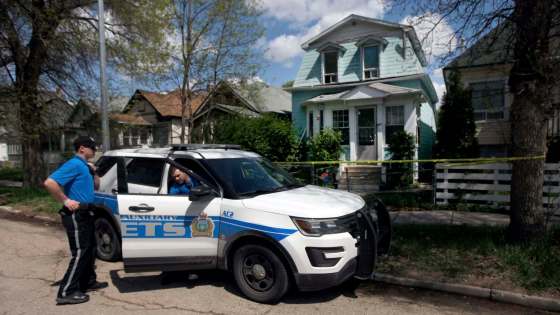 Cadets guard the scene of a homicide in which a woman was stabbed to death at 491 Simcoe St. Saturday. (Phil Hossack / Free Press files)