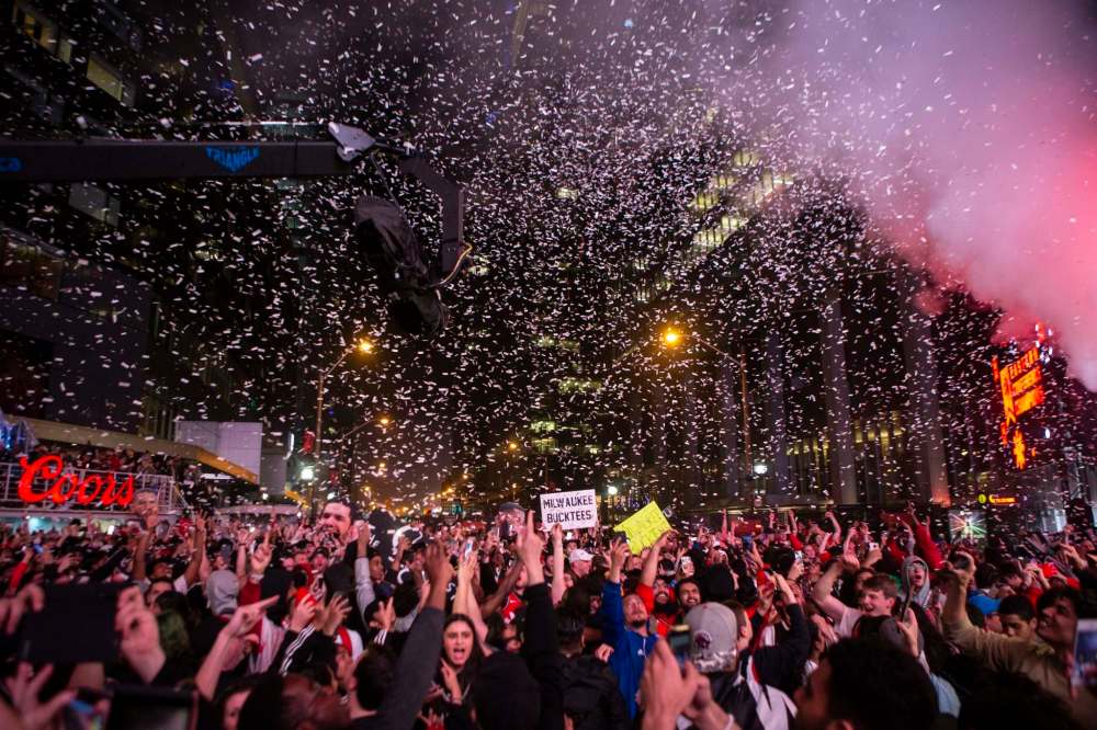 Toronto Raptors fans celebrate after the team's 100-94 game six win over the Milwaukee Bucks to become the NBA Eastern Conference champions on Saturday. (Chris Young / The Canadian Press files)