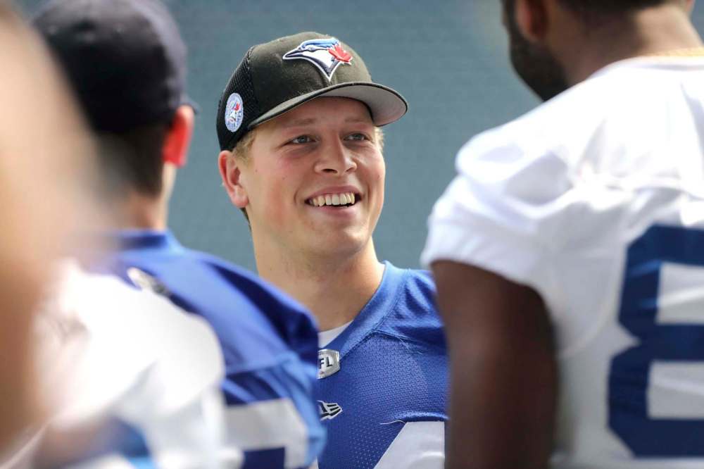 RUTH BONNEVILLE / WINNIPEG FREE PRESS
Winnipeg Rifles player Cole Sneesby on field with the Winnipeg Blue Bombers for walk-thru practice at Investors Group Field Thursday in preparation for their exhibition against the Edmonton Eskimos Friday.
