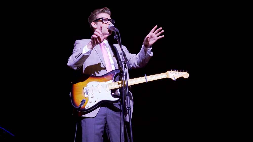 MERIT MOTION PICTURES
Jeff Giles dons the big black glasses to play Buddy Holly in Almost Almost Famous.