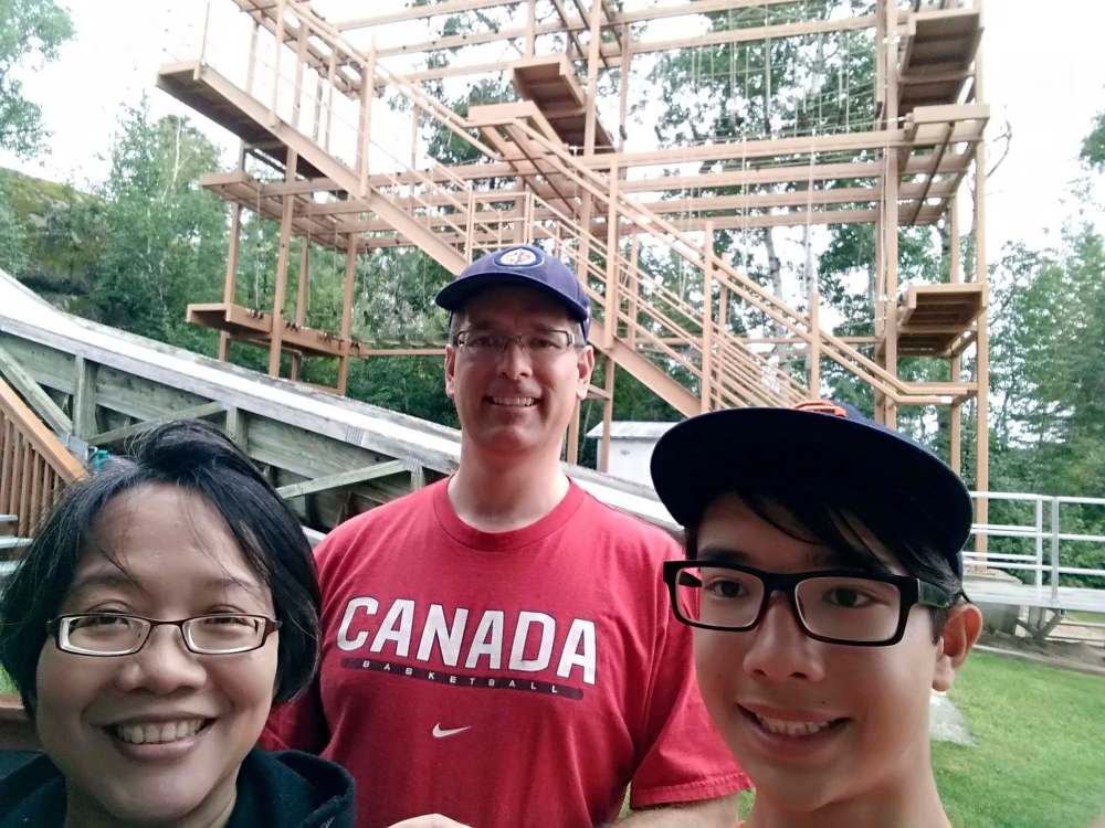 SUPPLIED
Matthew Pfahl with parents Trevor Pfahl and Luciana Puspita Witanto at Camp Cedarwood in 2018.