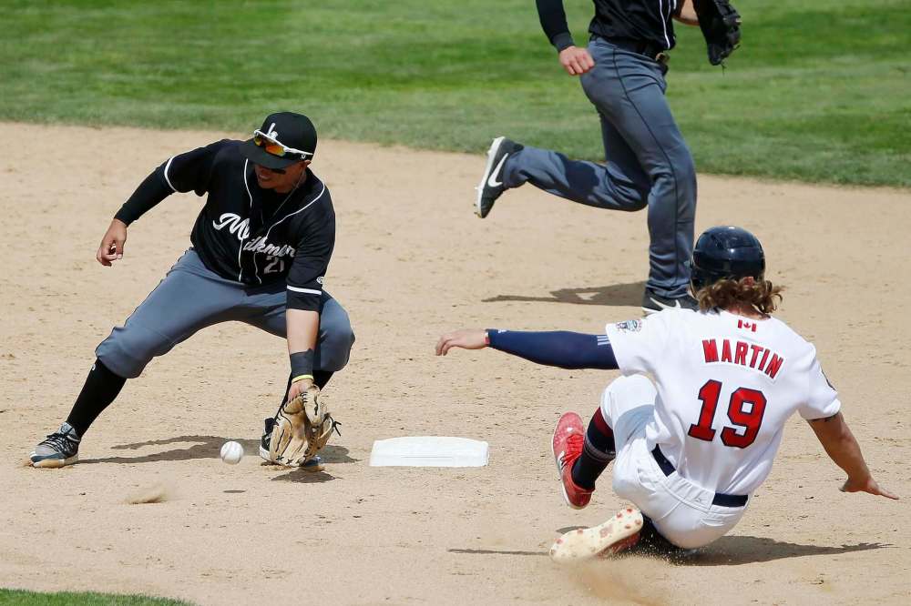 JOHN WOODS / WINNIPEG FREE PRESS
Winnipeg Goldeyes’ Kyle Martin (19) can’t beat the throw to Milwaukee Milkmen’s Steve Pascual (21) as he attempts to steal second.