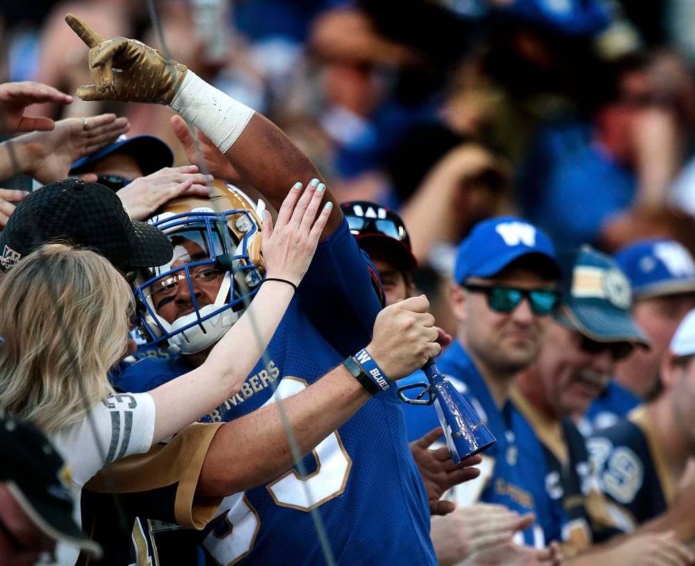 PHIL HOSSACK / WINNIPEG FREE PRESS - Winnipeg Blue Bomber #33 Andrew Harris celebrates the teams 1st touchdown Thursday night against the Edmonton Eskimos.