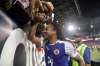 Julio Cortez / The Associated Press
Haiti midfielder Herold Jr. Charles visits with fans after a CONCACAF Gold Cup soccer match against Costa Rica, Monday.
