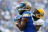 THE CANADIAN PRESS/John Woods
Winnipeg Blue Bombers' Chris Matthews can't hang onto the pass as Edmonton Eskimos' Forrest Hightower gets his hand on Matthews' mask during CFL action in Winnipeg Thursday. Matthews missed most of training camp and all of the pre-season due to an undisclosed injury.