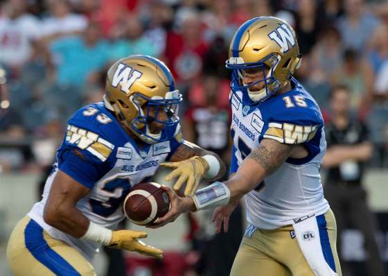 ADRIAN WYLD / THE CANADIAN PRESS FILESWinnipeg Blue Bombers QB Matt Nichols (right) was afforded plenty of space by an impressive offensive line, which also created holes for running back Andrew Harris to march 80 yards on 18 carries against the Ottawa Redblacks on Friday.