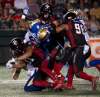 ADRIAN WYLD / THE CANADIAN PRESS
This is not the kind of pileup you want your franchise quarterback to be underneath. Bombers' Matt Nichols was injured on the play but should be ready to face the Argonauts.