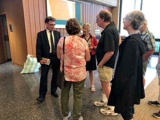 Above: Infill housing in Glenwood. Left: Coun. Brian Mayes (left) speaks with members of the Glenwood Neighbourhood Association after Monday’s community committee meeting.