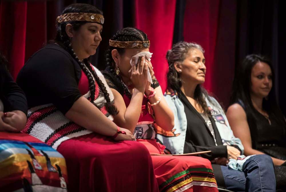 Darryl Dyck / The Canadian Press files
Lorelei Williams (second from left), whose cousin Tanya Holyk was murdered by serial killer Robert Pickton and aunt Belinda Williams went missing in 1978, wipes away tears while seated with Rhiannon Bennett (from left), Sophie Merasty and Summer Rain Bentham after responding to the National Inquiry into Missing and Murdered Indigenous Women and Girls in Vancouver on June 3.