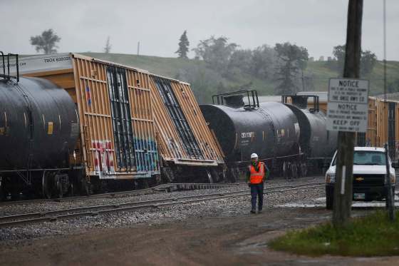 JOHN WOODS / WINNIPEG FREE PRESSThree cars on a BNSF train derailed on a track that runs between Empress and Strathcona in Winnipeg Wednesday closing Sargent Ave.