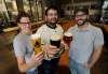 TREVOR HAGAN / WINNIPEG FREE PRESS files
Trans Canada Brewing Co.’s head brewer Morgan Wielgosz (from left), with president Matt Tallman and quality leader Josh Adler, has spearheaded a new line of fruit-infused sour beers for the Kenaston Boulevard brewery.