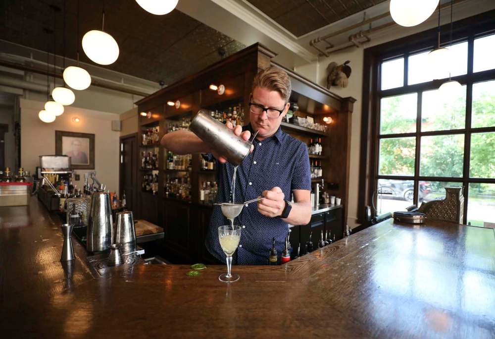 Langside Grocery bartender Casey Bee says an all-ages beverage begins with a question: does the customer prefer their beverages spicy, fruity or savoury? (Ruth Bonneville / Winnipeg Free Press)
