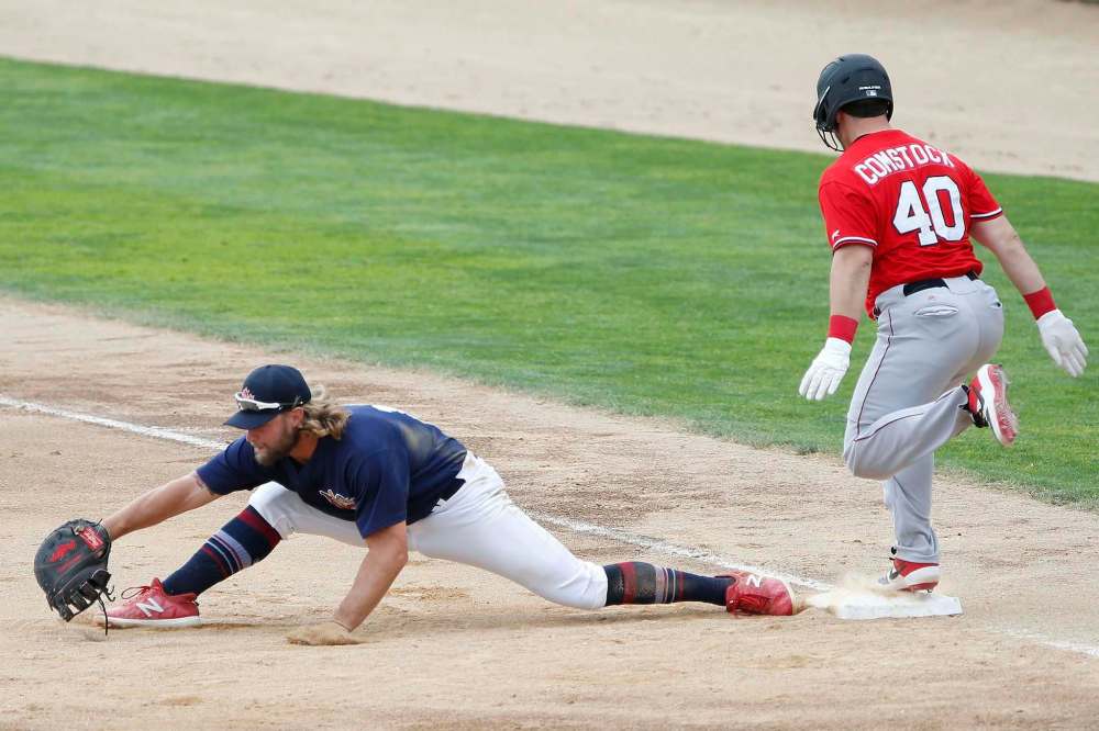 JOHN WOODS / WINNIPEG FREE PRESS
Fargo-Moorhead RedHawks’ Daniel Comstock was upset Sunday afternoon after being called out at first, as it appears Winnipeg’s Kyle Martin is not touching the bag.