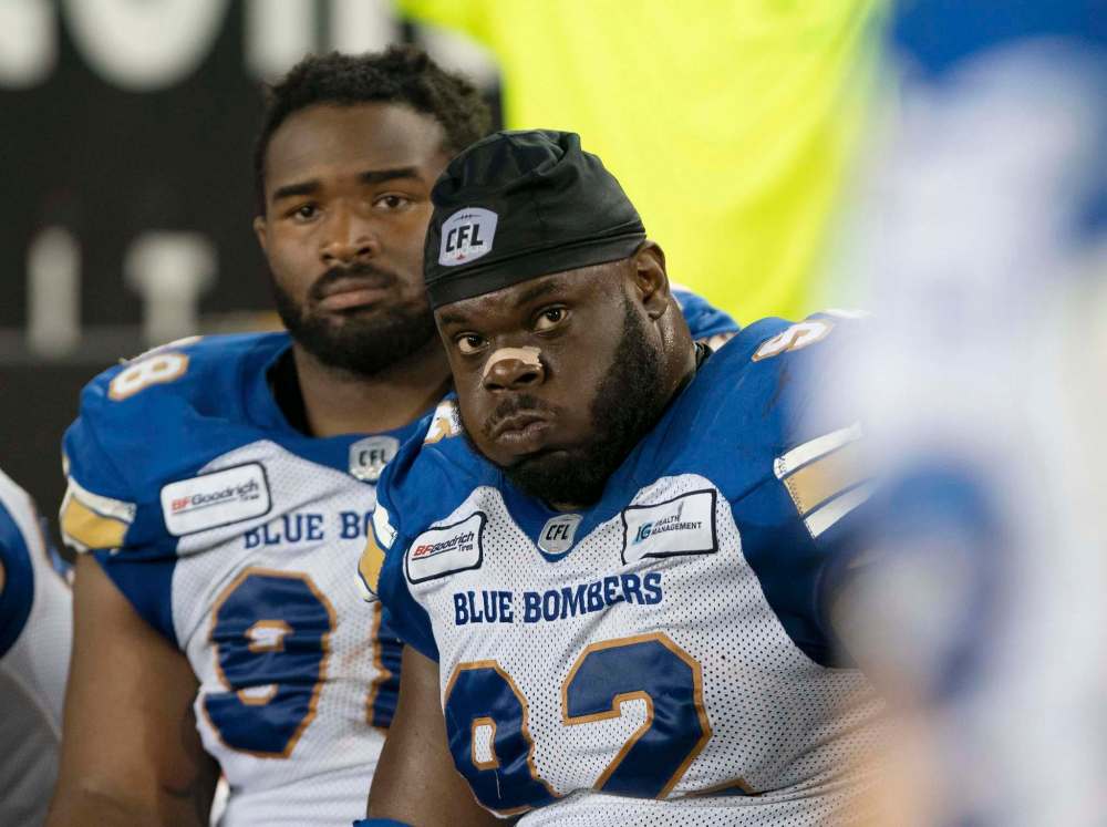 PETER POWER / THE CANADIAN PRESS FILES
Blue Bombers defensive tackle Drake Nevis (right) during the final minutes of their game against the Hamilton Tiger-Cats.