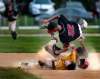 PHIL HOSSACK / WINNIPEG FREE PRESS
St Boniface baserunner Kyle Becker slams his head into the gravel at second base in a three-way collision with Elmwood’s Owen Harms (top) and Zach Delaquis.