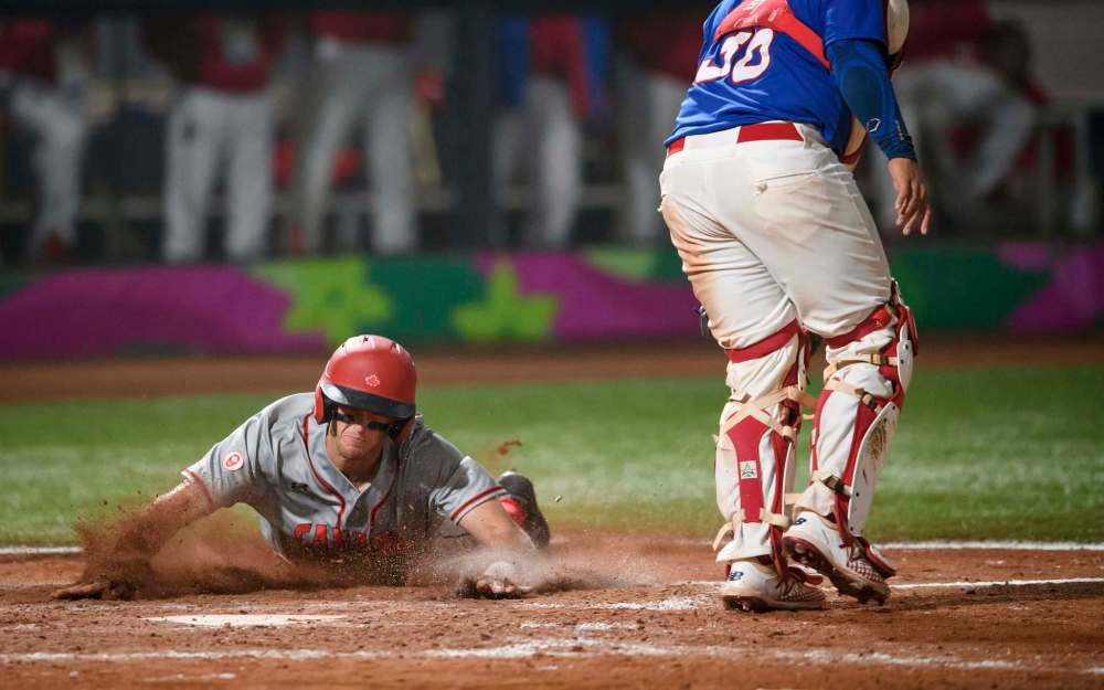 Vincent Ethier / COC
Winnipeg Goldeyes infielder Wesley Darvill scores Canada’s lone run in a 6-1 loss to Puerto Rico in the Pan Am Games gold-medal game.