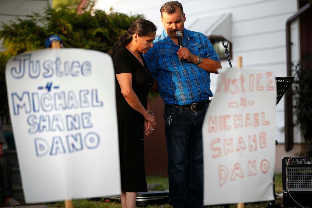 JOHN WOODS / WINNIPEG FREE PRESS
Earl and Wanda Dano, parents of Michael Dano at a vigil Tuesday in front of 757 Chalmers Street East where Michael was found deceased. The police ruled it a suicide but the family is calling for further investigation.
