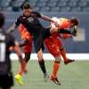 PHIL HOSSACK / WINNIPEG FREE PRESS
Valour FC's Michele Paolucci collides with Forge FC's Alexander Achinioti-Jonsson (right) and Bertrand Owundi (rear) at IG Field Saturday evening.