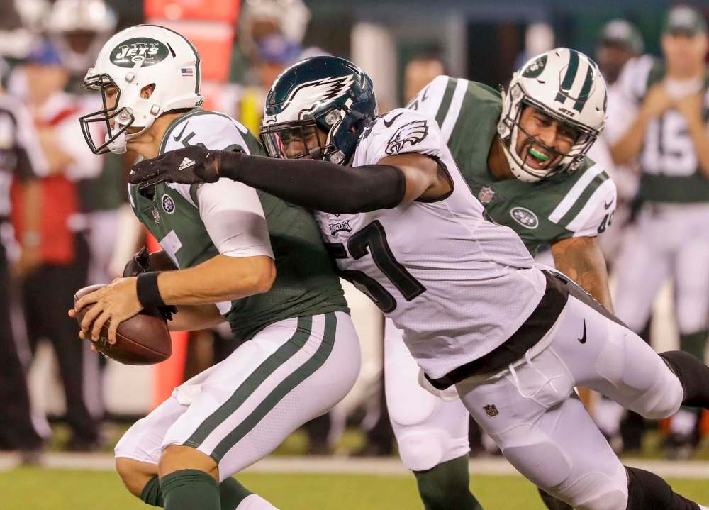 Yong Kim / Philadelphia Daily News files
Defensive end Alex McCalister with the Philadelphia Eagles, centre, playing the New York Jets in 2017.