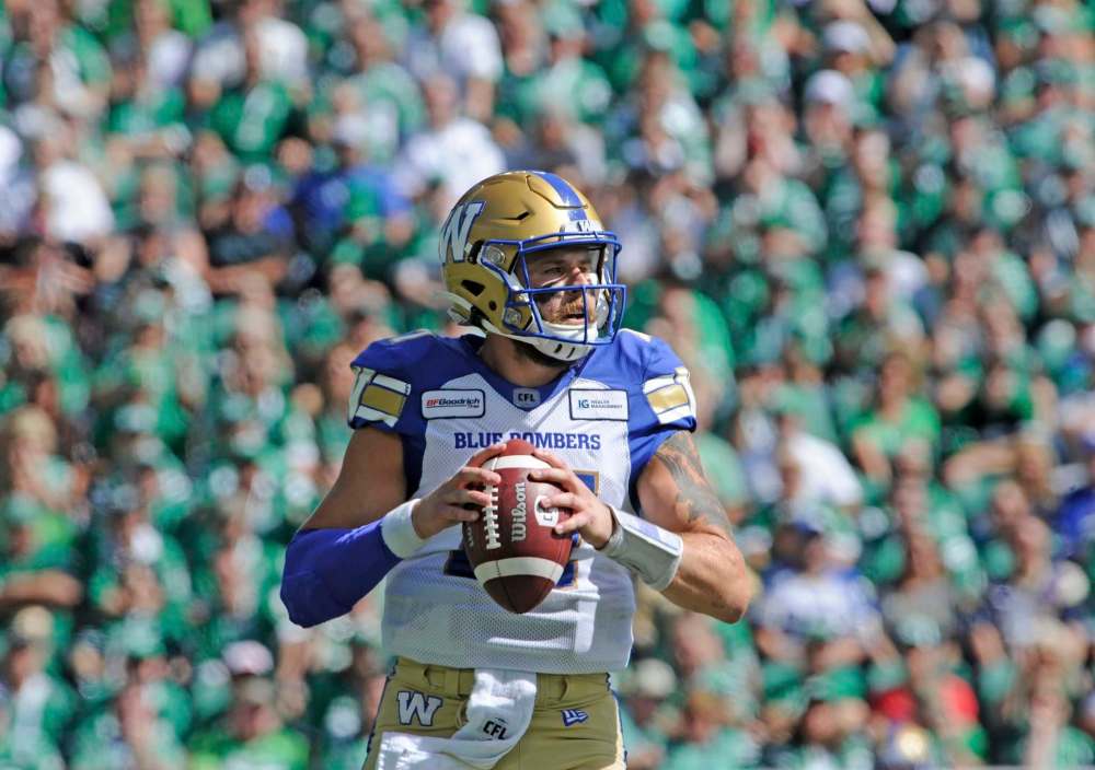 MARK TAYLOR / THE CANADIAN PRESS
Winnipeg Blue Bombers quarterback Chris Streveler scrambles during a play in the first half against the Saskatchewan Roughriders in Regina on Sunday.