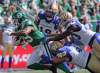 MARK TAYLOR / THE CANADIAN PRESS FILES
Roughriders running back William Powell fights for yards against the Bombers during the Labour Day Classic in Regina. The Bombers have to reload today for another shot at their Prairie rival.