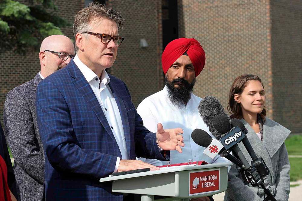 Surrounded by supporters, Liberal Leader Dougald Lamont made a series of education-related election promises outside Maples Collegiate Saturday. (JESSICA BOTELHO-URBANSKI/WINNIPEG FREE PRESS)