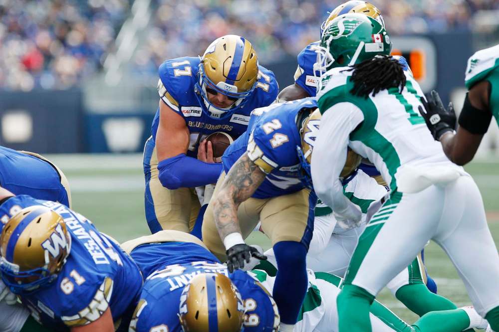 John Woods / The Canadian Press files
Blue Bombers quarterback Chris Streveler runs for a touchdown against the Saskatchewan Roughriders. Streveler is gaining confidence as he gets more reps as the team’s starter in place of the injured Matt Nichols.