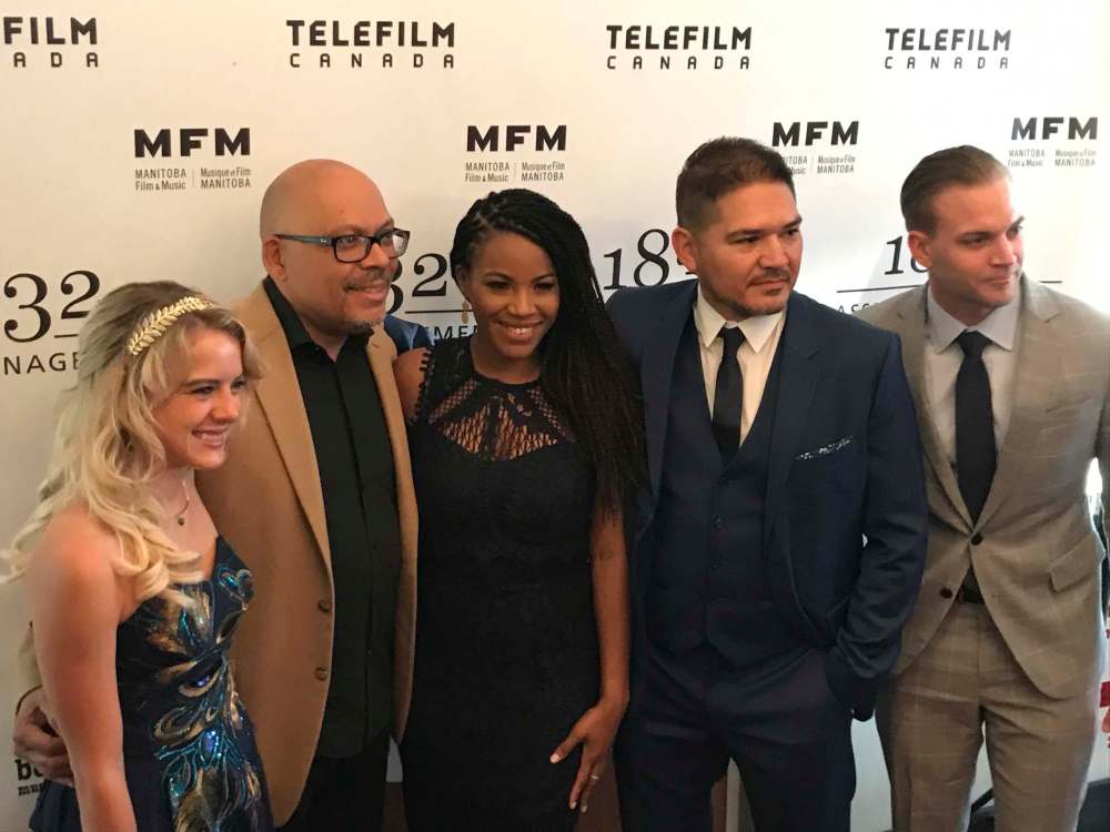 Laura Wiggins, Robert Adetuyi, Lisa Bell, Gabriel Daniels and Marshall Williams do the red carpet for Stand! (Randall King / Winnipeg Free Press)