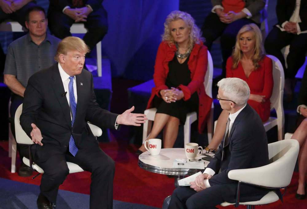 Then-Republican presidential candidate Donald Trump participates in a CNN town hall with Cooper in Milwaukee in 2016. (Charles Rex Arbogast /  Associated Press files)