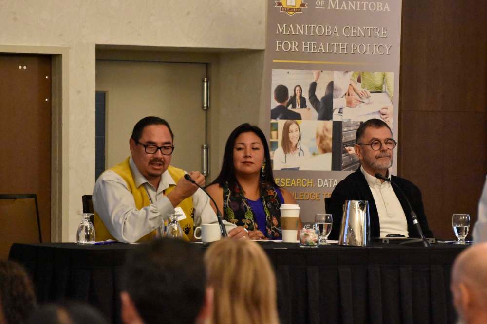 From left: Sheldon Kent, Leona Star and Alan Katz speak at the release of the report . (Tessa Vanderhart / Winnipeg Free Press)