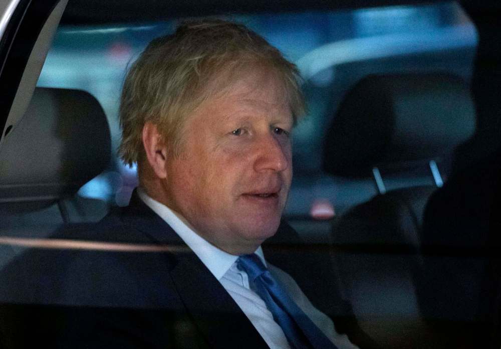Mark Lennihan / The Associated Press
British Prime Minister Boris Johnson will have to leave New York early.