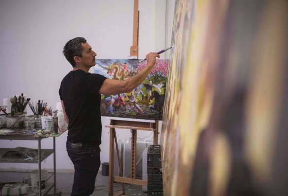 RYAN VAN DER HOUT PHOTOArtist Kent Monkman works on a painting in his Toronto studio. His exhibition, Shame and Prejudice: A Story of Resilience, opens today at the Winnipeg Art Gallery.