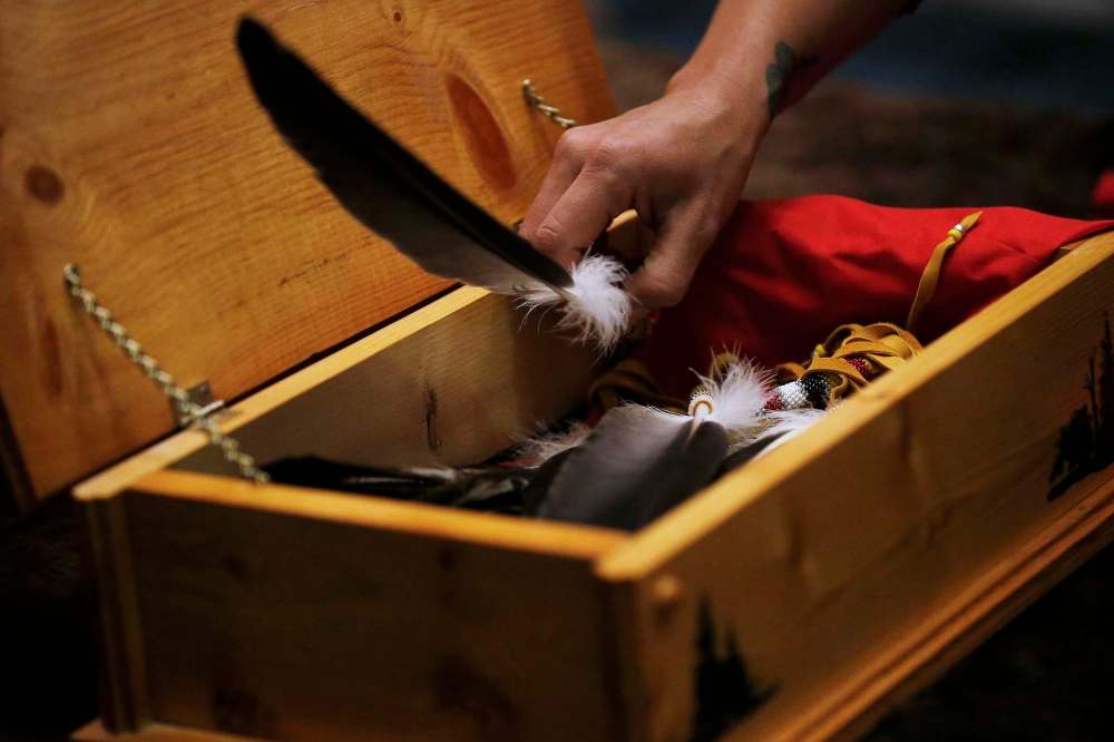 An eagle feather is not something you take or buy, but something gifted to you. Feathers are designed to build community, which is why elders say they have two sides and a spine. (John Woods / The Canadian Press files)
