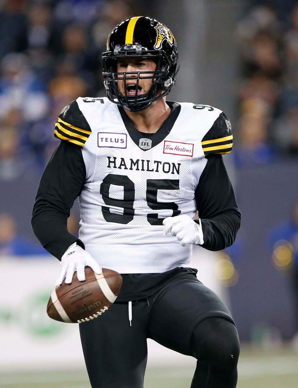 JOHN WOODS / THE CANADIAN PRESS
Tiger-Cats' Julian Howsare celebrates his sack of Bombers quarterback Chris Streveler.