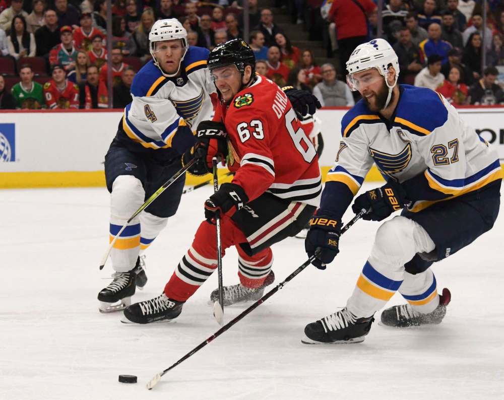 David Banks / The associated Press files
Ex-Blackhawks defenceman Carl Dahlstrom (centre, battling with Blues Carl Gunnarsson, left, and Alex Pietrangelo) flew from Europe to join the Jets in New York City on Wednesday.