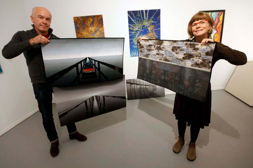 Photographer Dmitry Kirshner and fabric artist Cathie Ugrin show off their respective works from their collaborative exhibition, ViewPoints: A Unique Photo Fabric Journey. (Phil Hossack / Winnipeg Free Press)