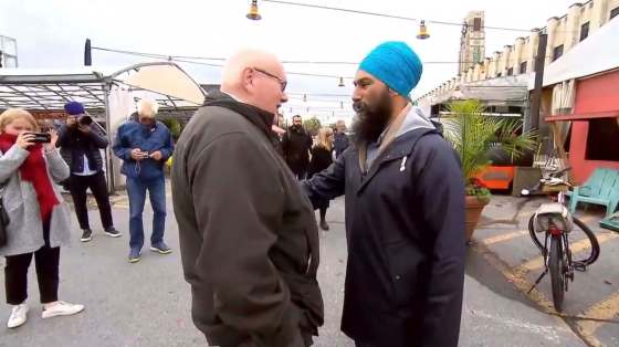 TWITTERJagmeet Singh speaks with a man who suggested the NDP leader cut off his turban to look more Canadian, at Montreal’s Atwater Market on Wednesday.
