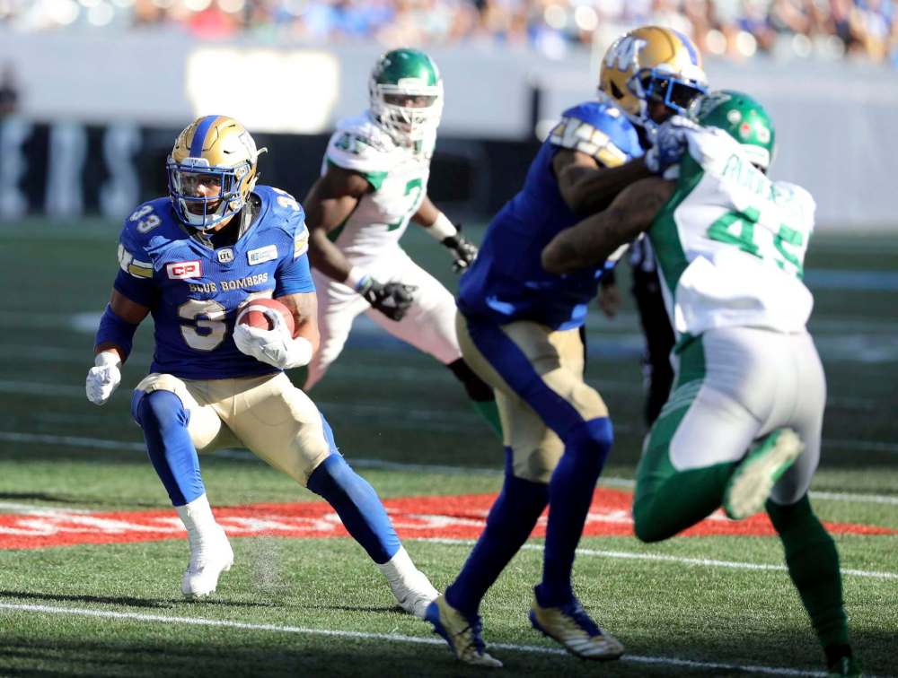 Trevor Hagan / The Canadian Press files
Bombers running back Andrew Harris (left) is looking forward to today’s game in Regina.