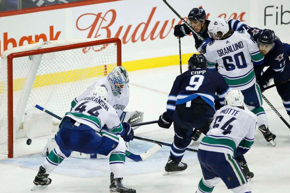 John Woods / The Canadian Press files
Brandon Tanev, Adam Lowry and Andrew Copp became known as the ‘TLC’ line during their time together on the Jets. But now the band’s broken up, with Tanev going to the Penguins.