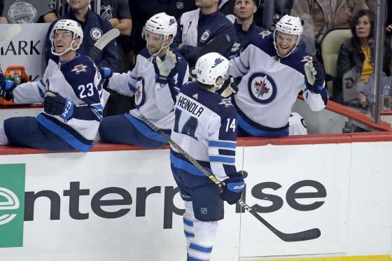 (AP Photo/Gene J. Puskar)Winnipeg Jets' rookie defenceman Ville Heinola celebrates after scoring his first career NHL goal during the first period against the Pittsburgh Penguins in Pittsburgh, Tuesday.